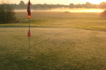 photo of red flag on golf course
